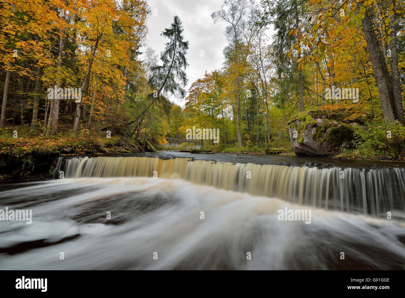 Waterfall in the middle of the forest Stock Photo - Alamy