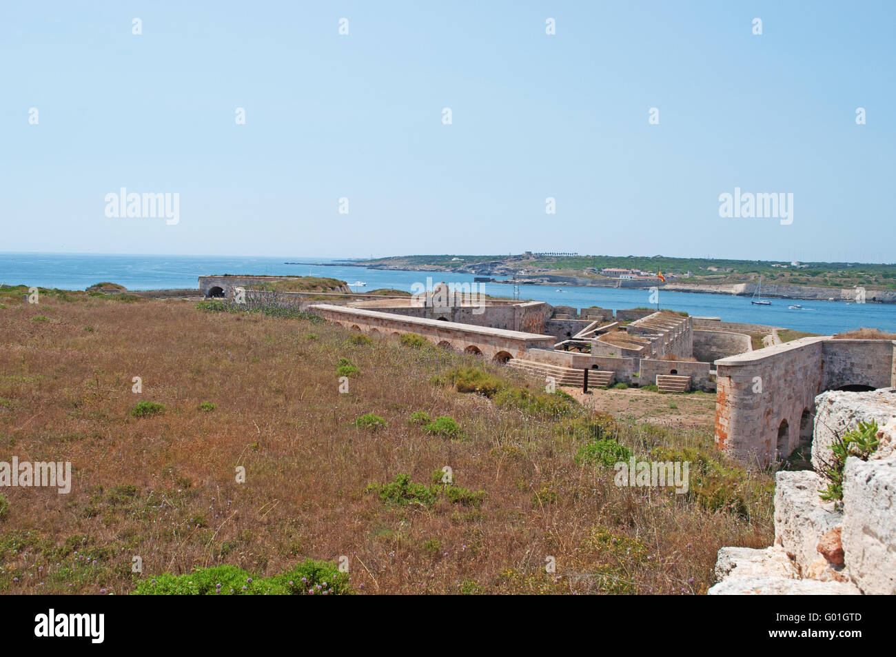 Menorca: view of Fortaleza de La Mola, the Fortress of Isabel II, a military complex on the peninsula of La Mola, at the entrance of the port of Mahon Stock Photo