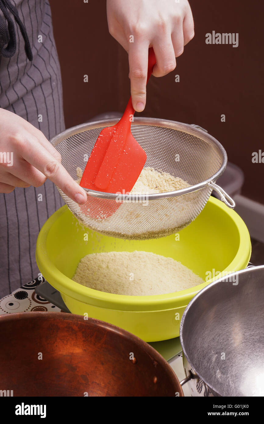 Sieving flour into mixing bowl hi-res stock photography and images - Alamy