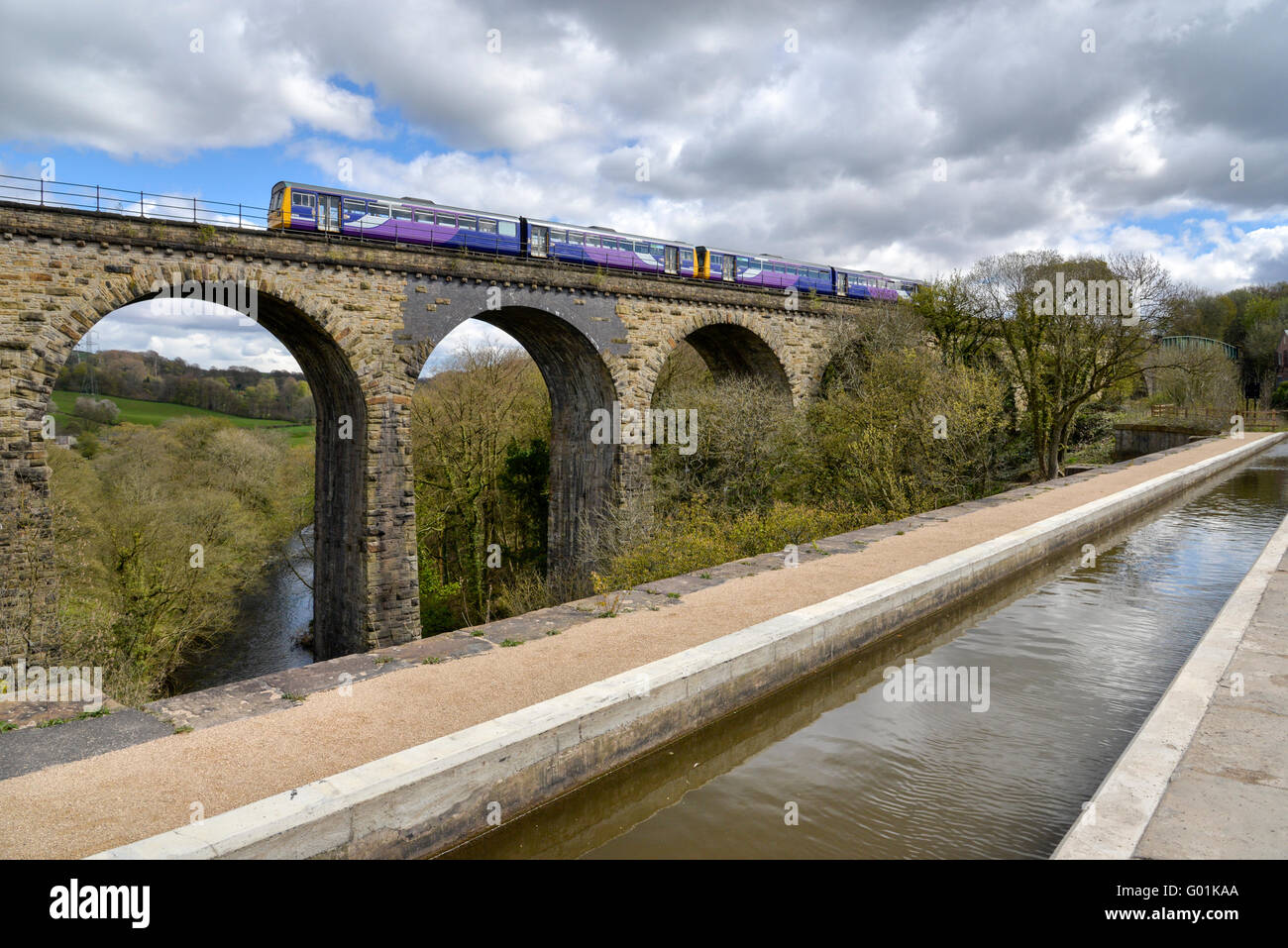 Train on the bridge beside Marple aquaduct on the Peak Forest canal, Marple, Stockport. Stock Photo