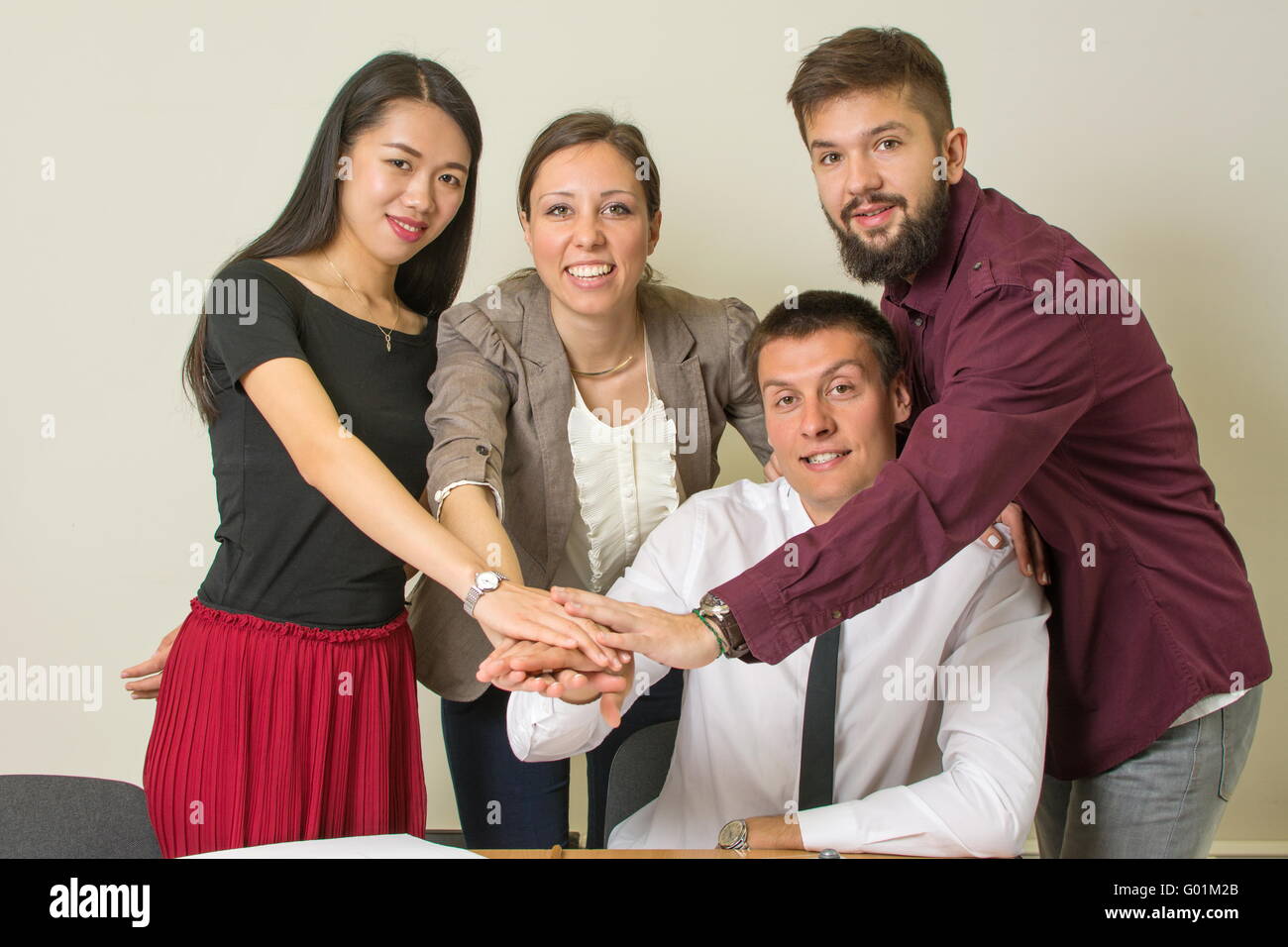 Multicultural team at the office ready for new business success Stock Photo