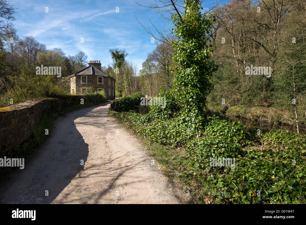 Old cottage beside the river Goyt near Marple, Stockport. A sunny spring day. Stock Photo