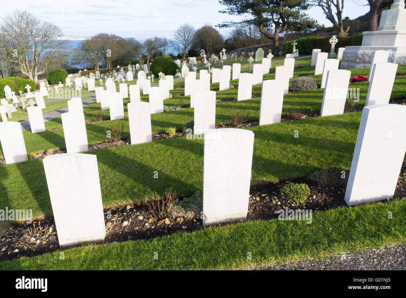 Backs of white graves at military naval cemetery, Portland Bill, Dorset, England, UK. Stock Photo
