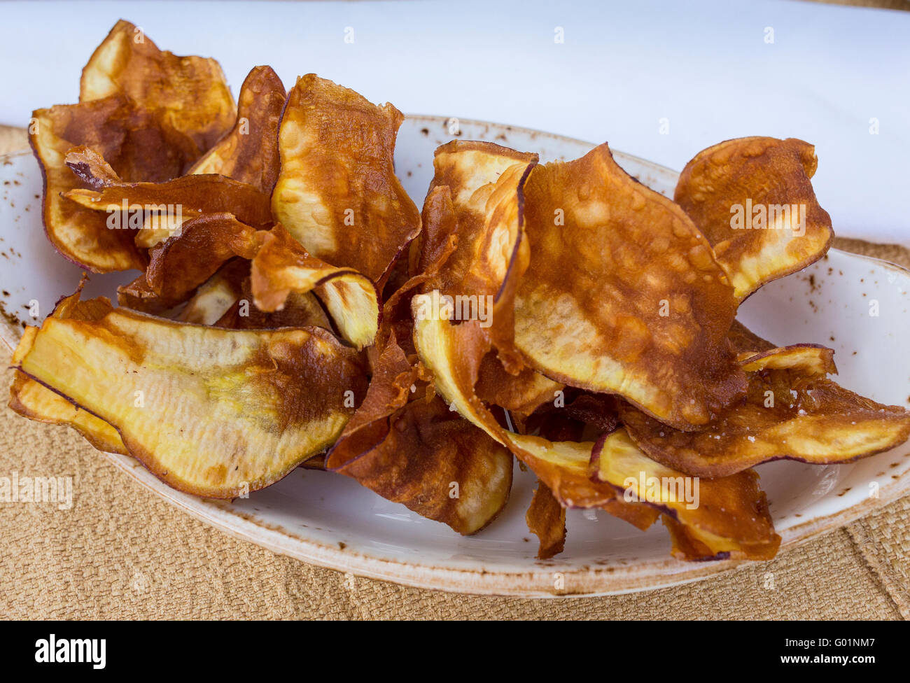 COSTA RICA -  Fried sweet potato chips on plate Stock Photo