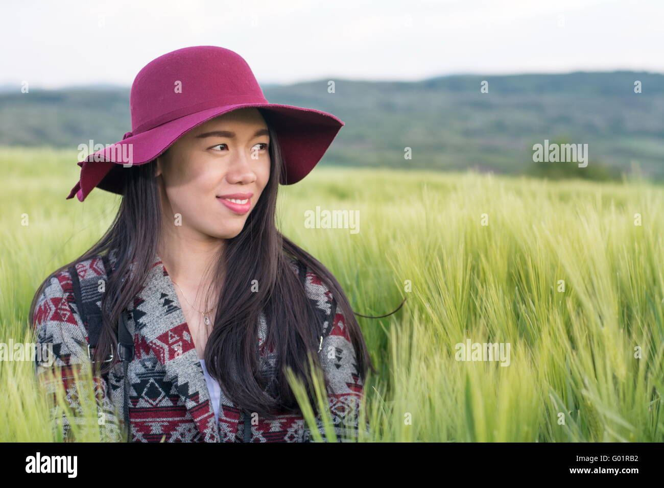 Young woman in a wheat field Stock Photo