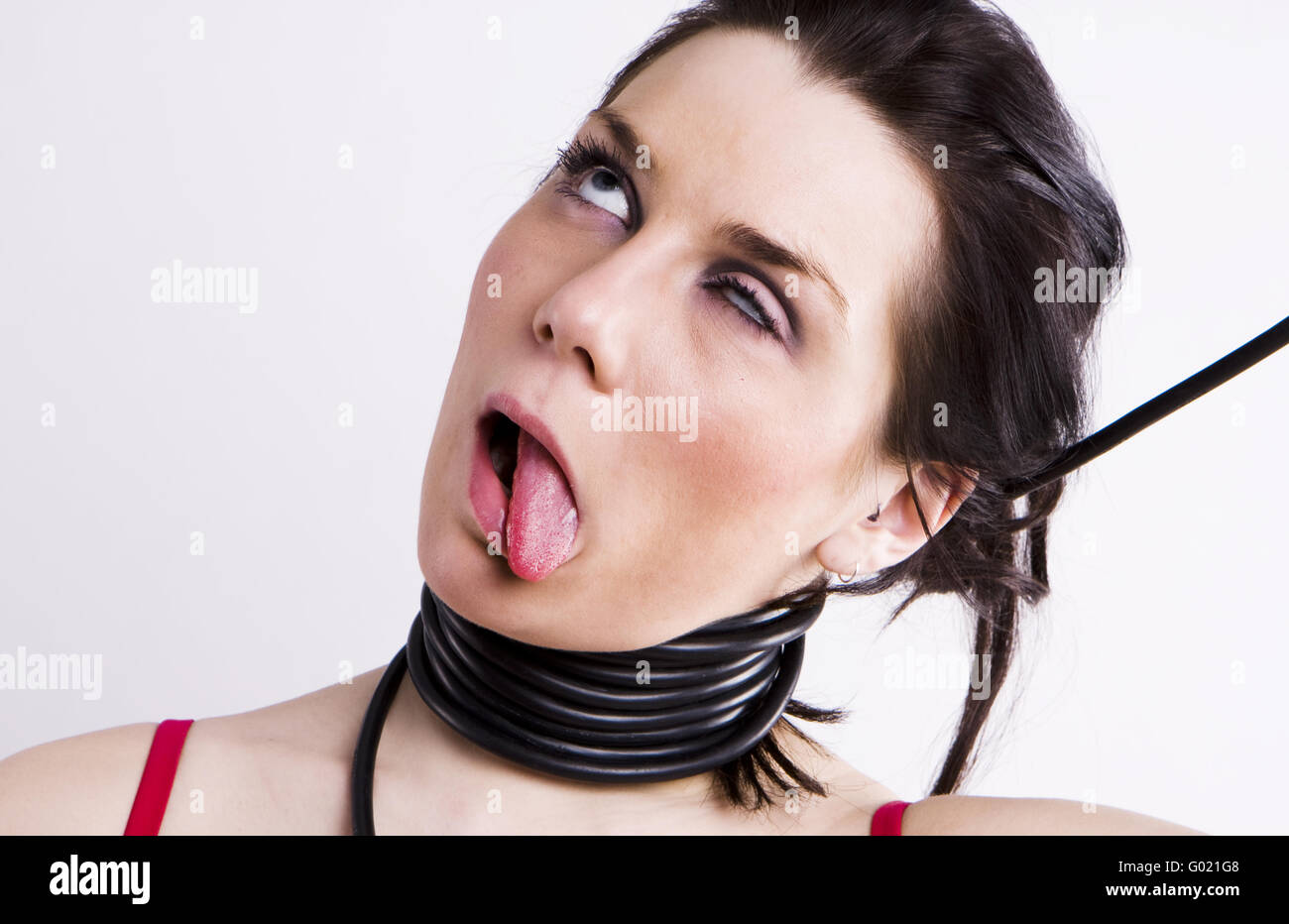 Young woman throttle herself by rope. white  background Stock Photo