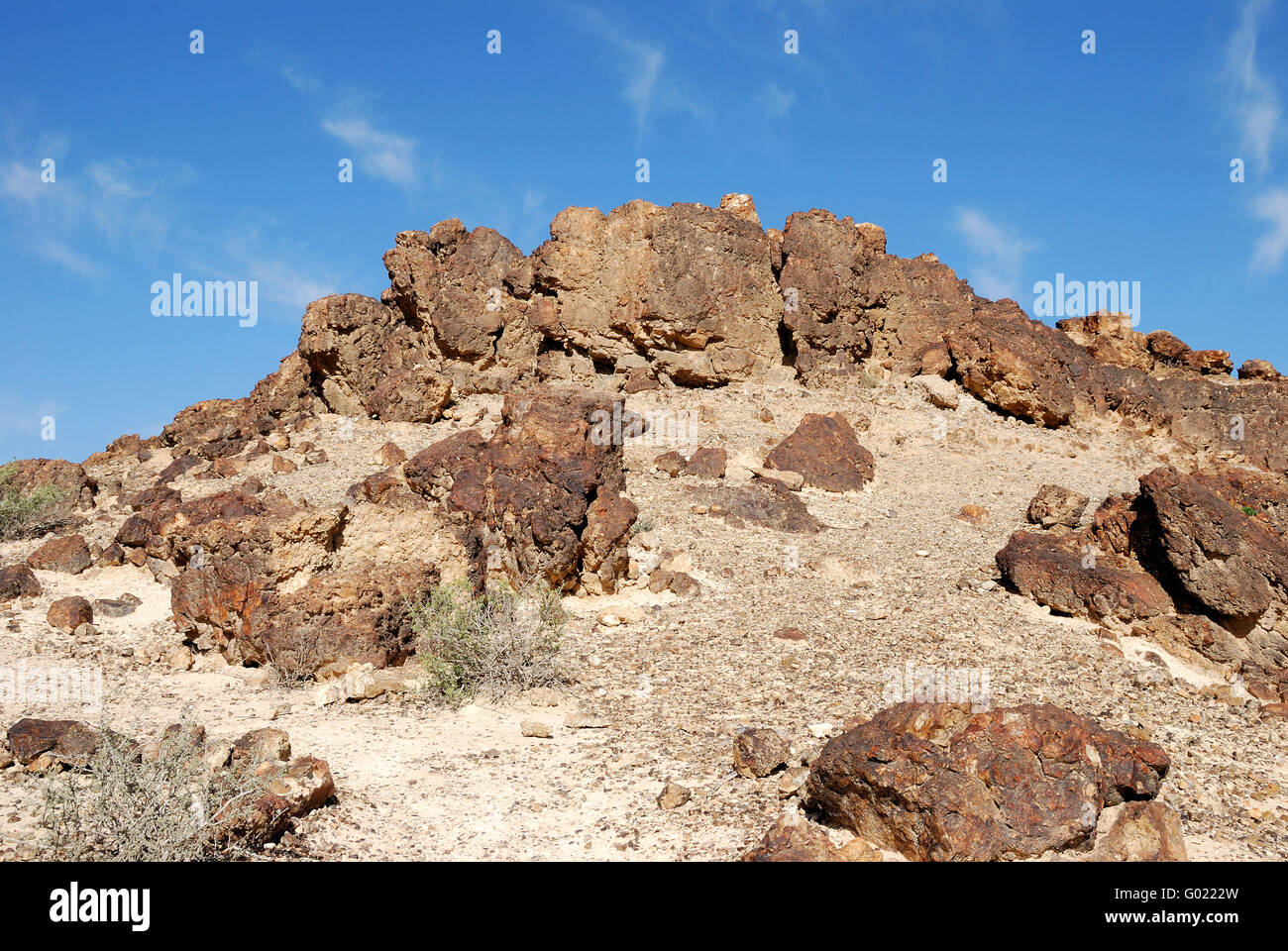 Ancient rocks under blue sky. Desert Negev Stock Photo - Alamy