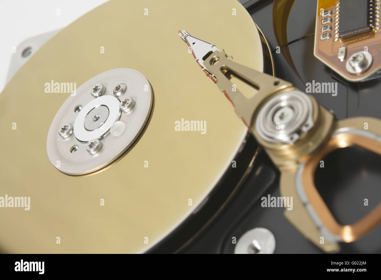 Closeup of the platters and read/write head of a computer hard drive