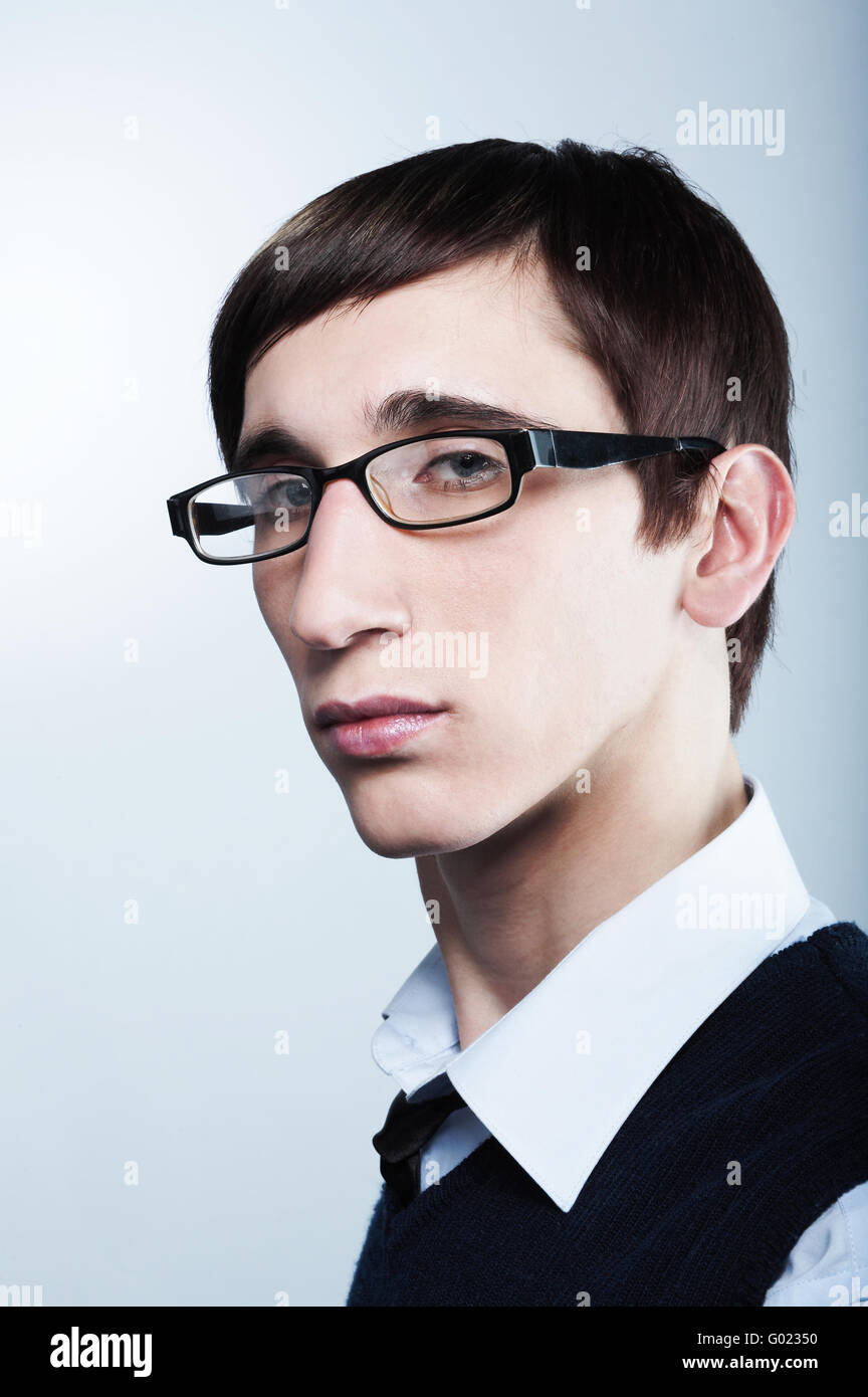 Cute young guy with fashion haircut wearing glasses Stock Photo