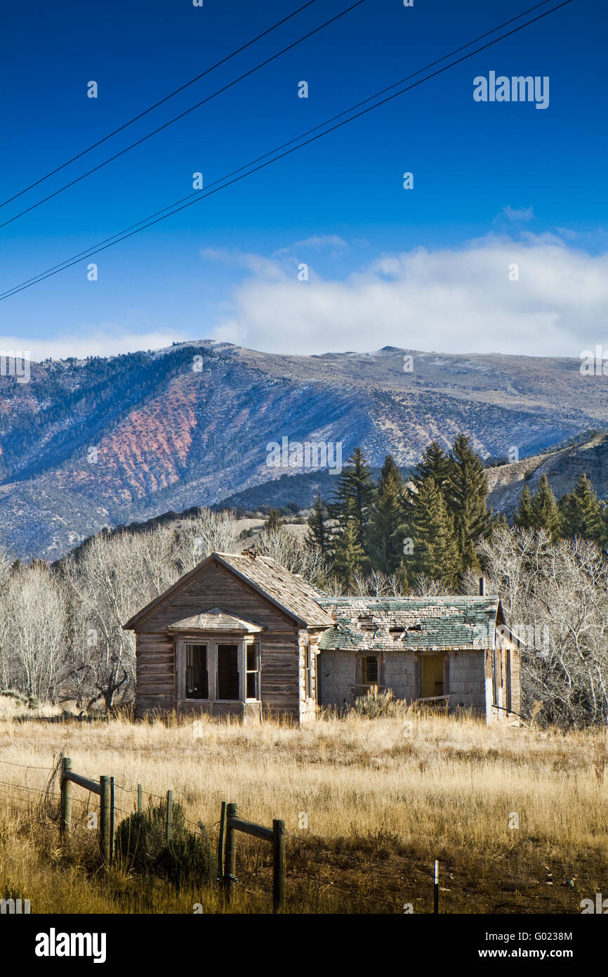 An abandoned wooden house in the mountains in Colorado Stock Photo