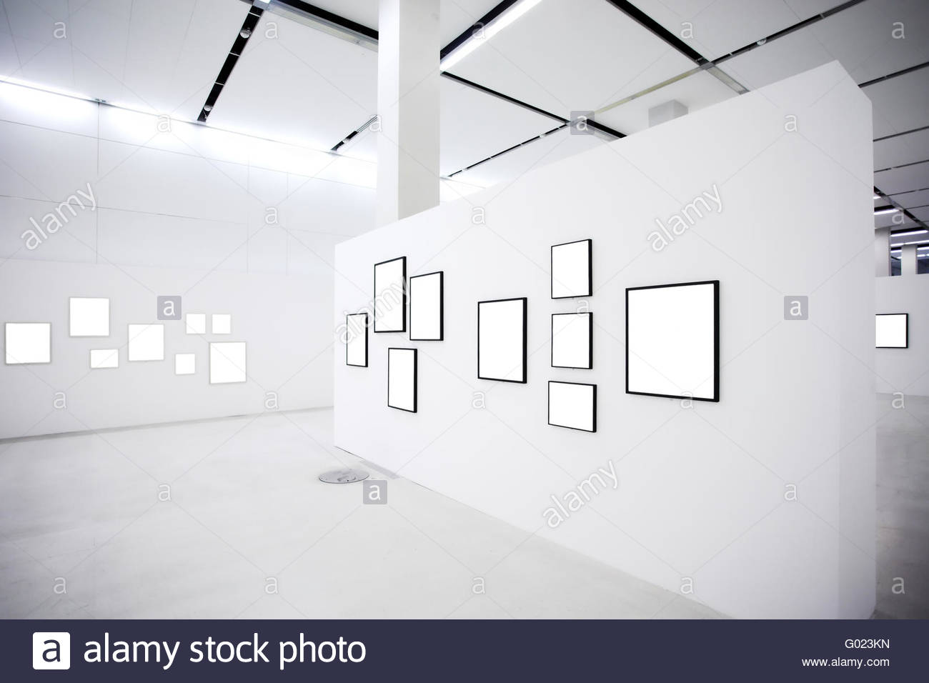 Exhibition in museum with many empty frames on white walls Stock Photo ...
