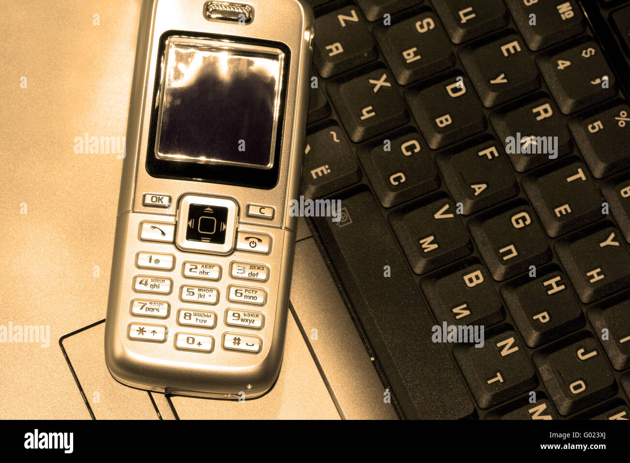 Mobile phone and computer keyboard (business conception) Stock Photo