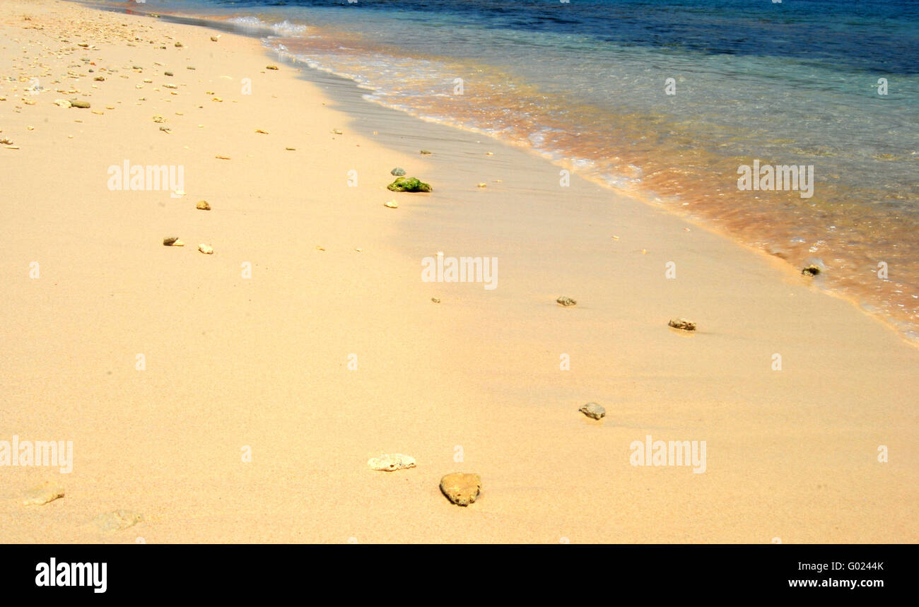 Sand and water on a tropical beach Stock Photo
