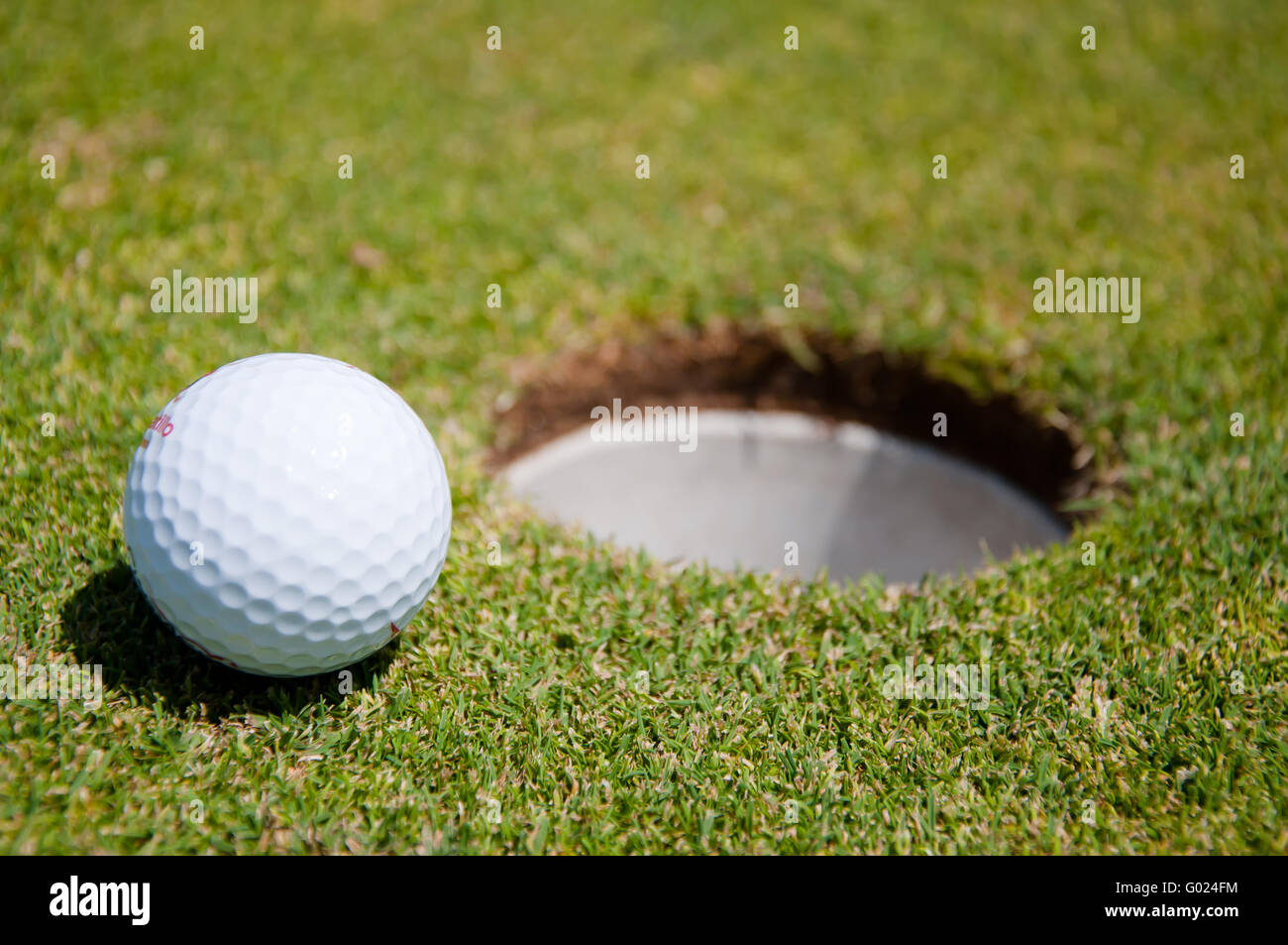 golf hole with ball Stock Photo