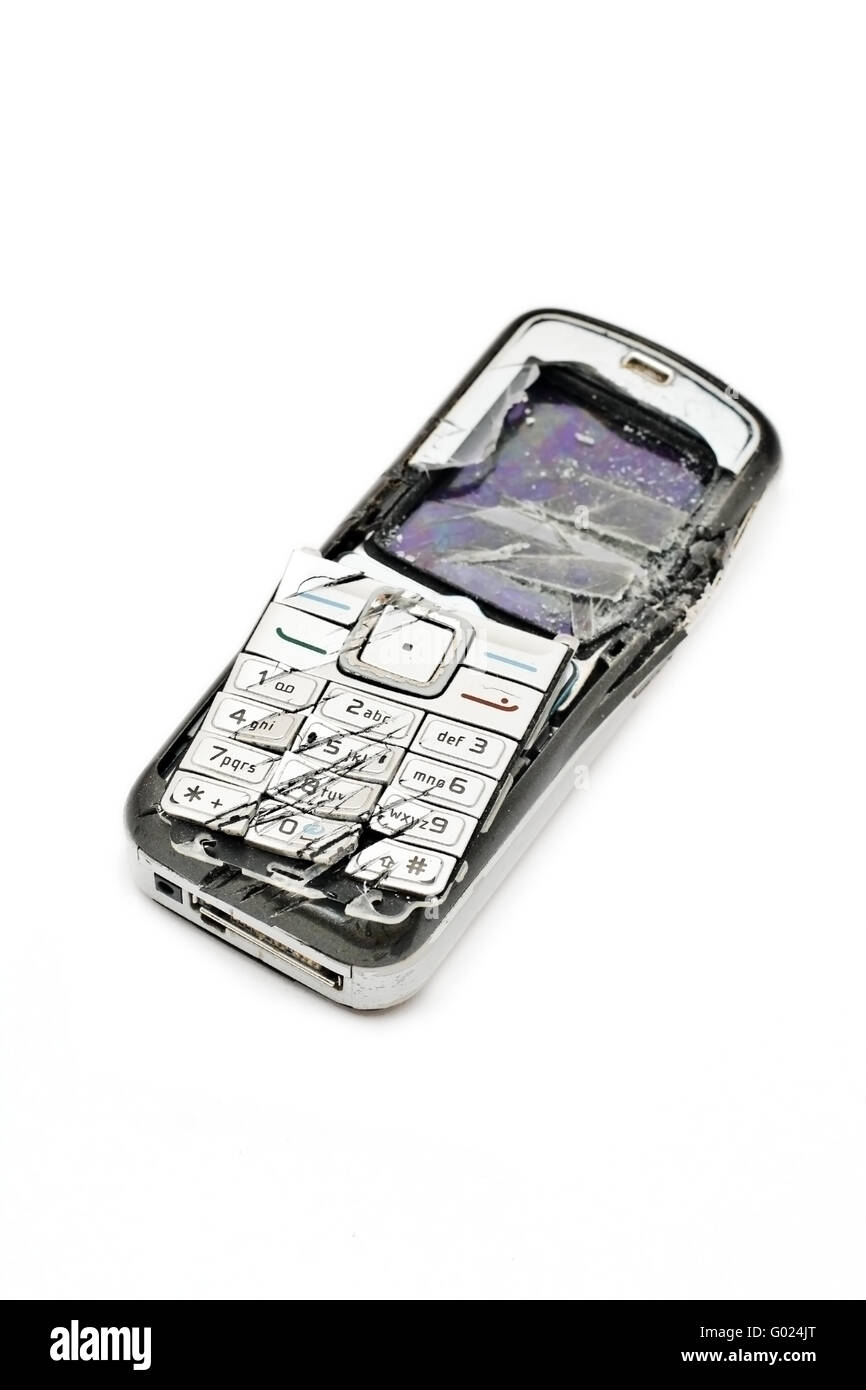 Smashed cellular phone isolated on the white background Stock Photo - Alamy