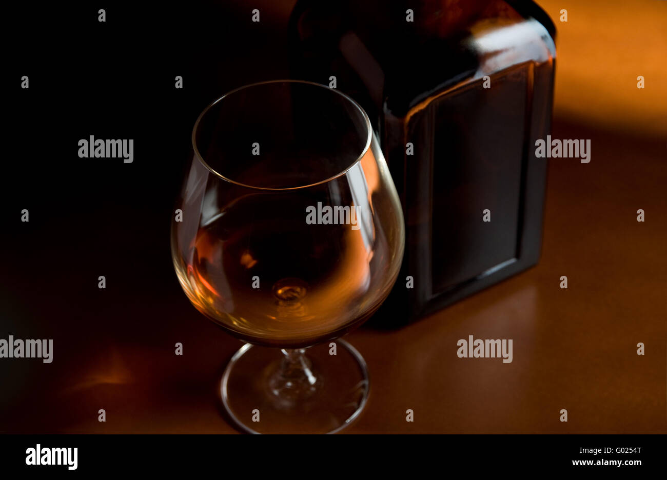 Brandy glass and bottle Stock Photo Alamy