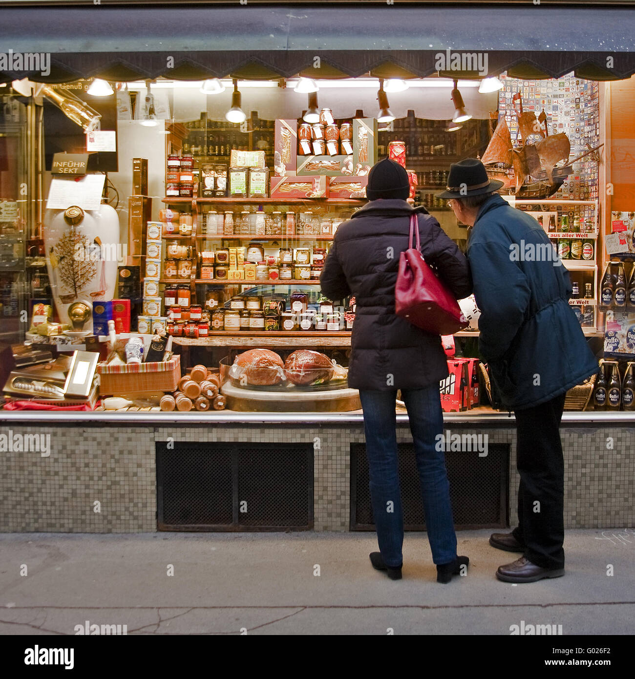 couple before a delicatessen shop in Vienna Stock Photo