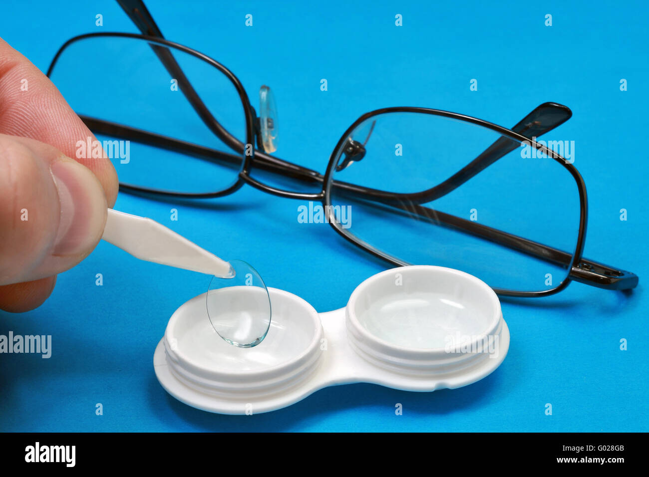 The procedure for changing eyeglasses on the contact lens Stock Photo