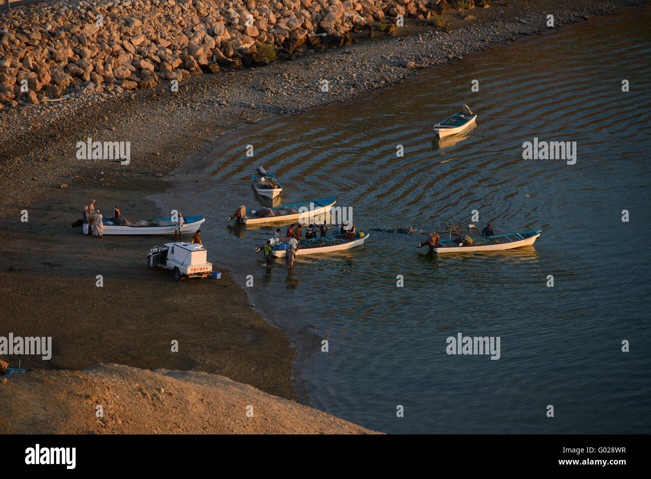 Fishermen gather on the coast of Sur, Oman. Stock Photo