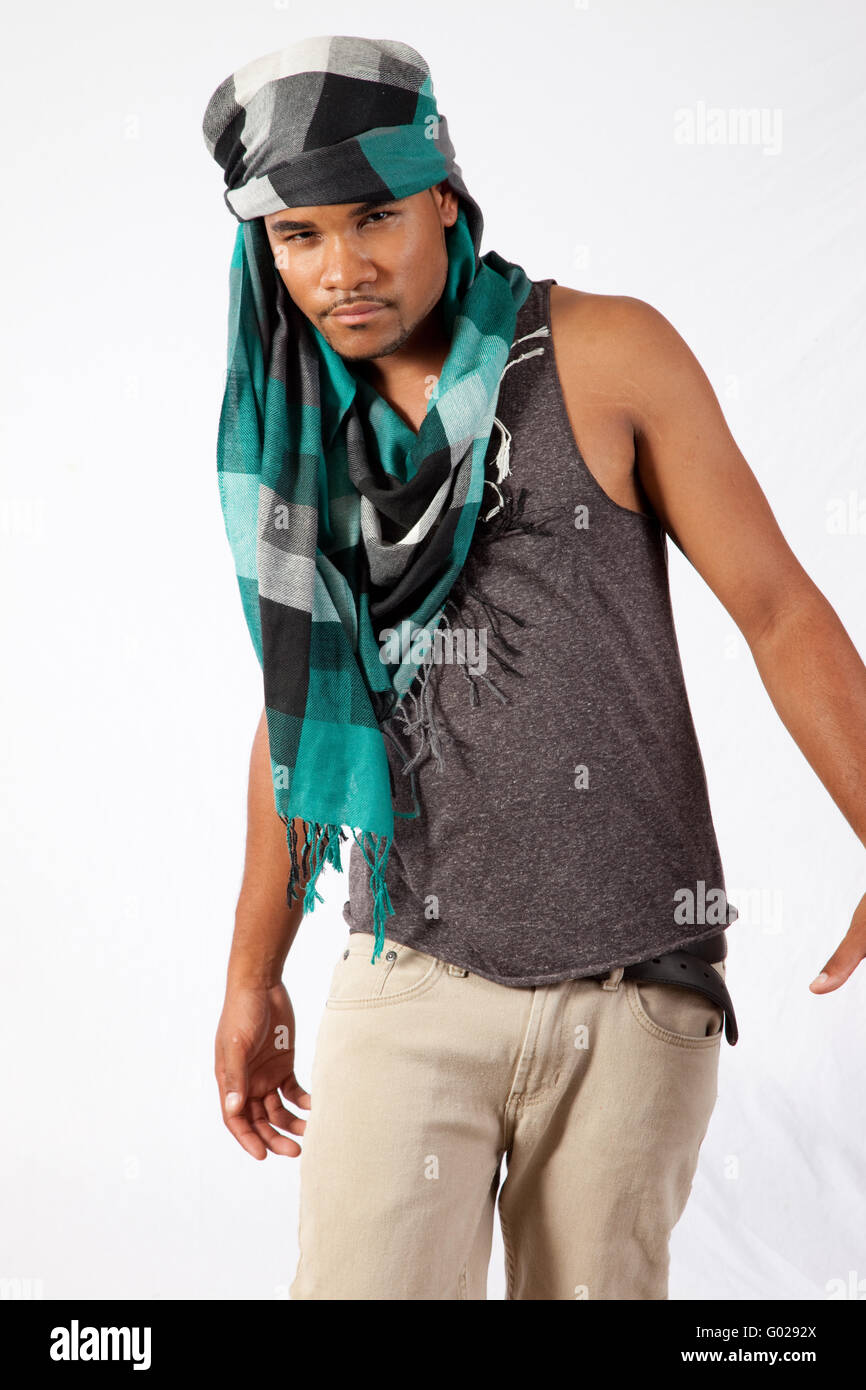 Young black man wearing a head scarf and looking serious Stock Photo - Alamy