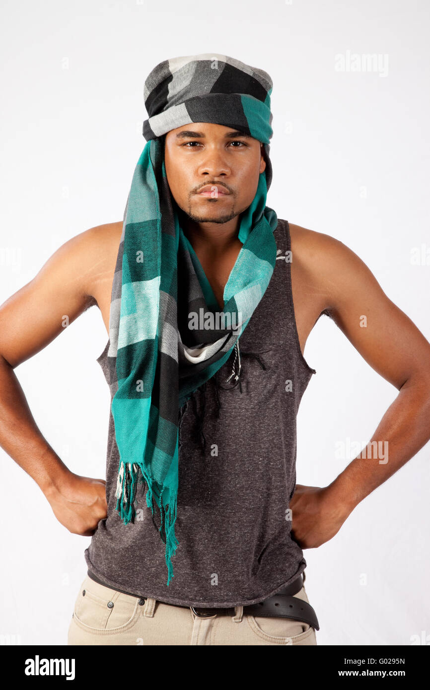 Young black man wearing a head scarf and looking serious Stock Photo - Alamy