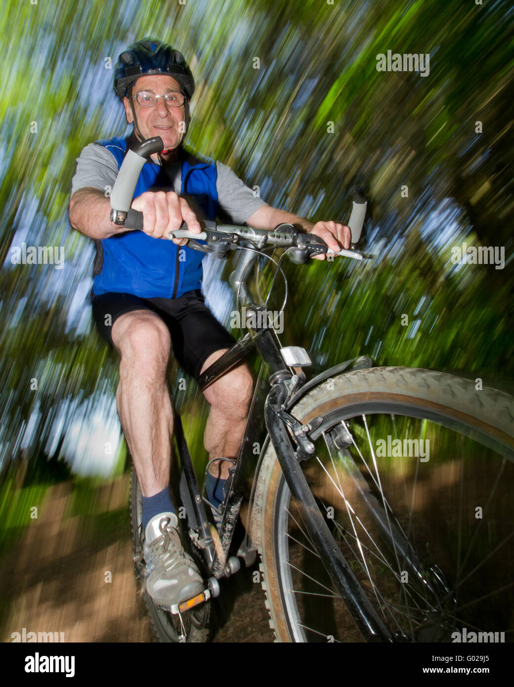 Senior cycling on a mountain bike Stock Photo