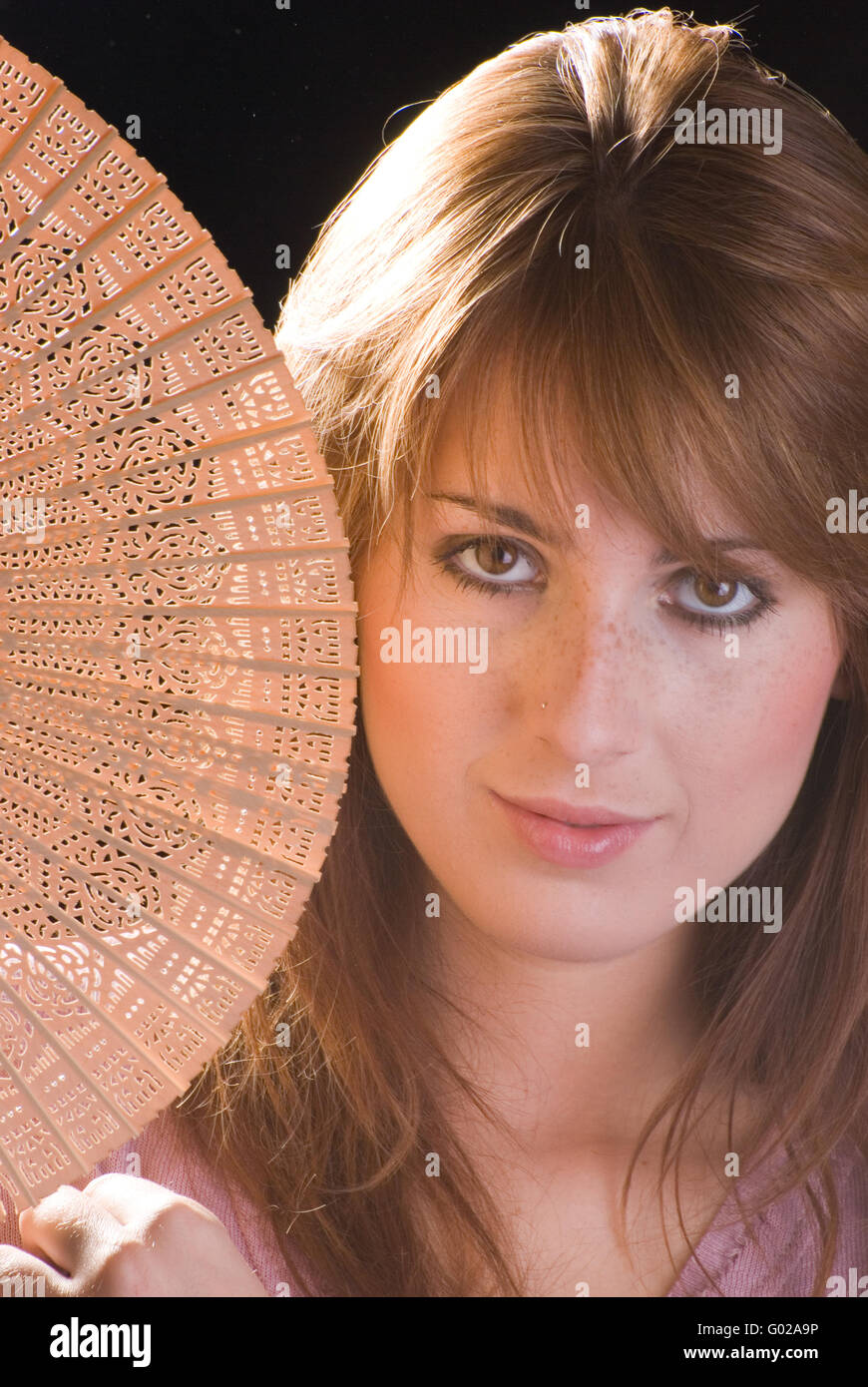 Woman with a Fan Stock Photo