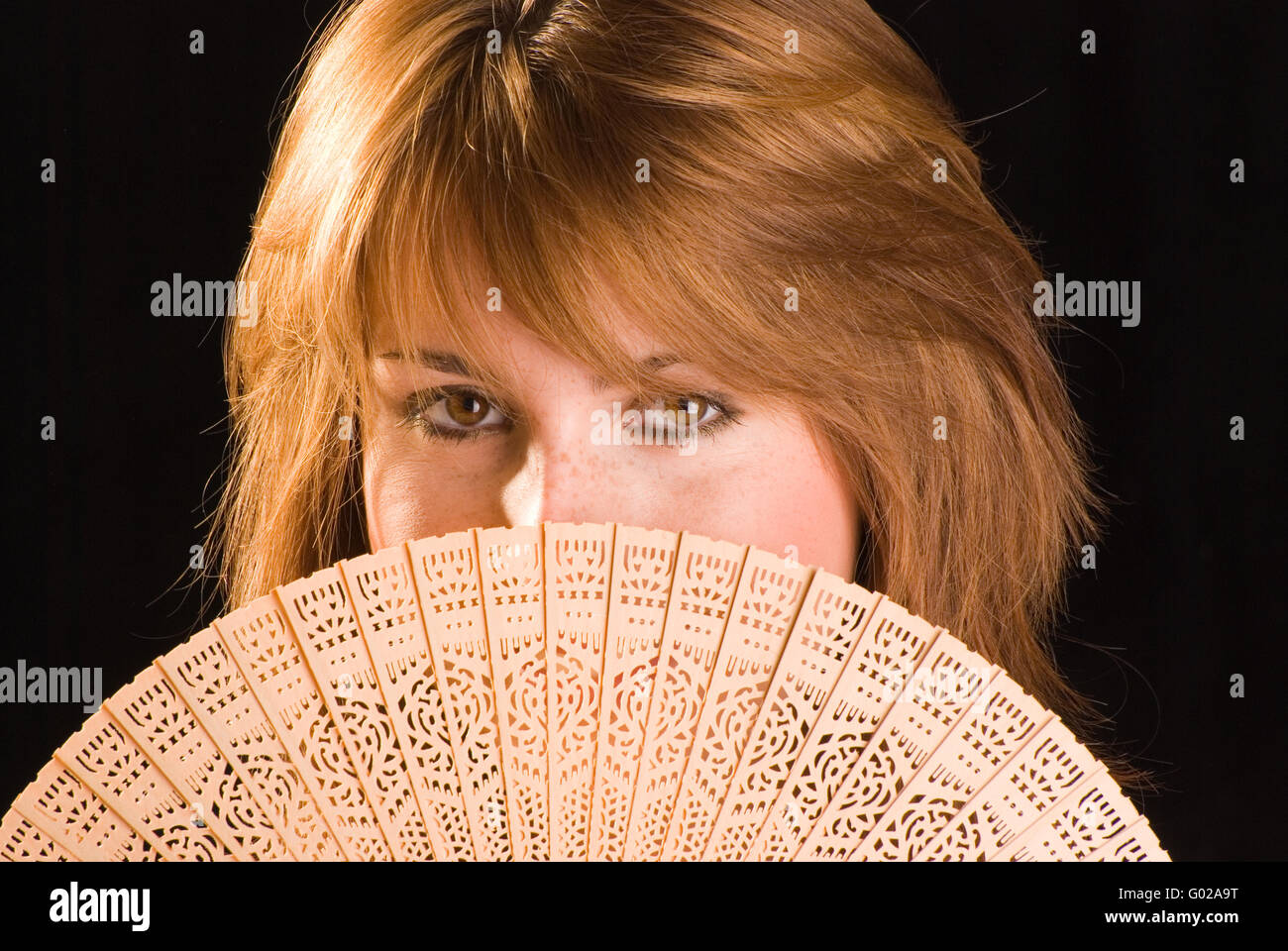 Woman with a Fan Stock Photo