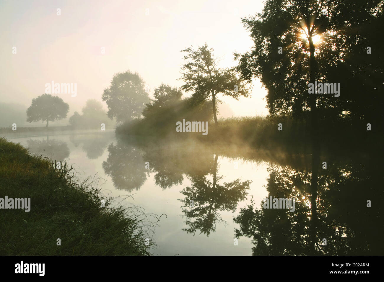 morning mist on Canal du Centre, Burgundy, France Stock Photo
