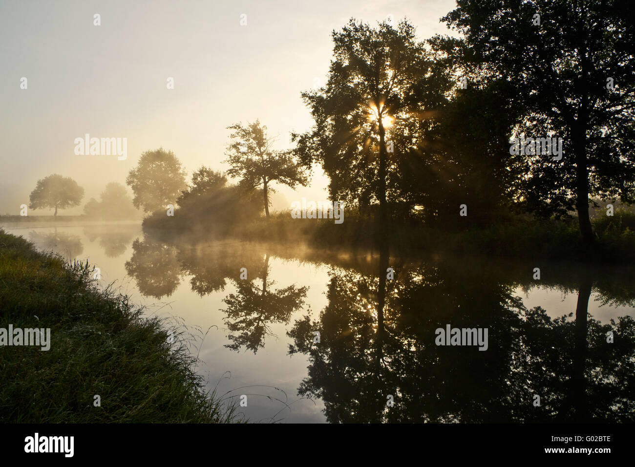 morning mist on Canal-du-Centre, Burgundy, France Stock Photo