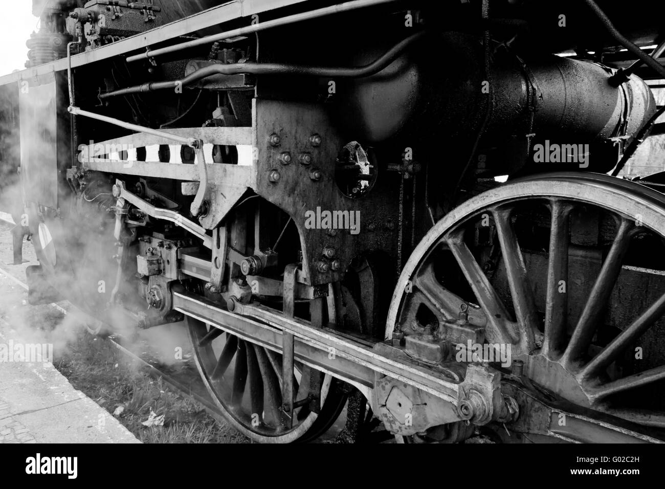 Close up of the wheels and suspension of the old steam engine Stock Photo