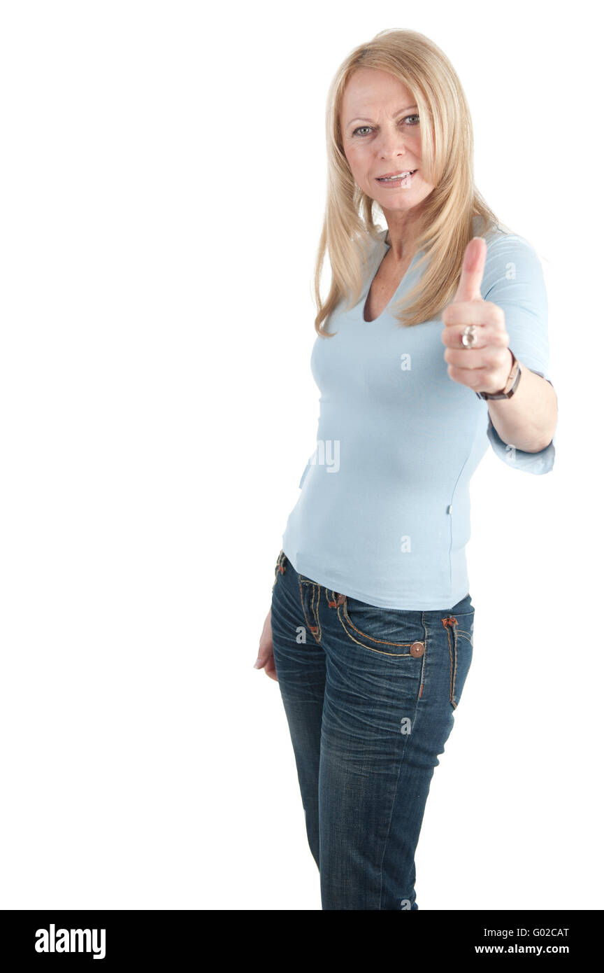 Middle aged woman with thumb up on white backgroun Stock Photo