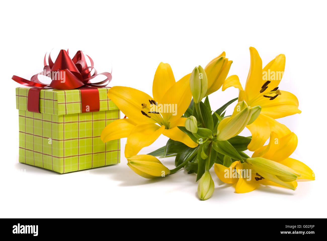 Yellow lily and gift box on a white background Stock Photo Alamy