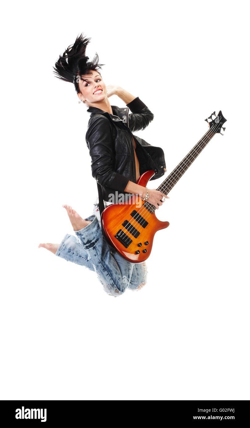 Beautiful rock-n-roll girl jumping with guitar isolated over white  background Stock Photo - Alamy