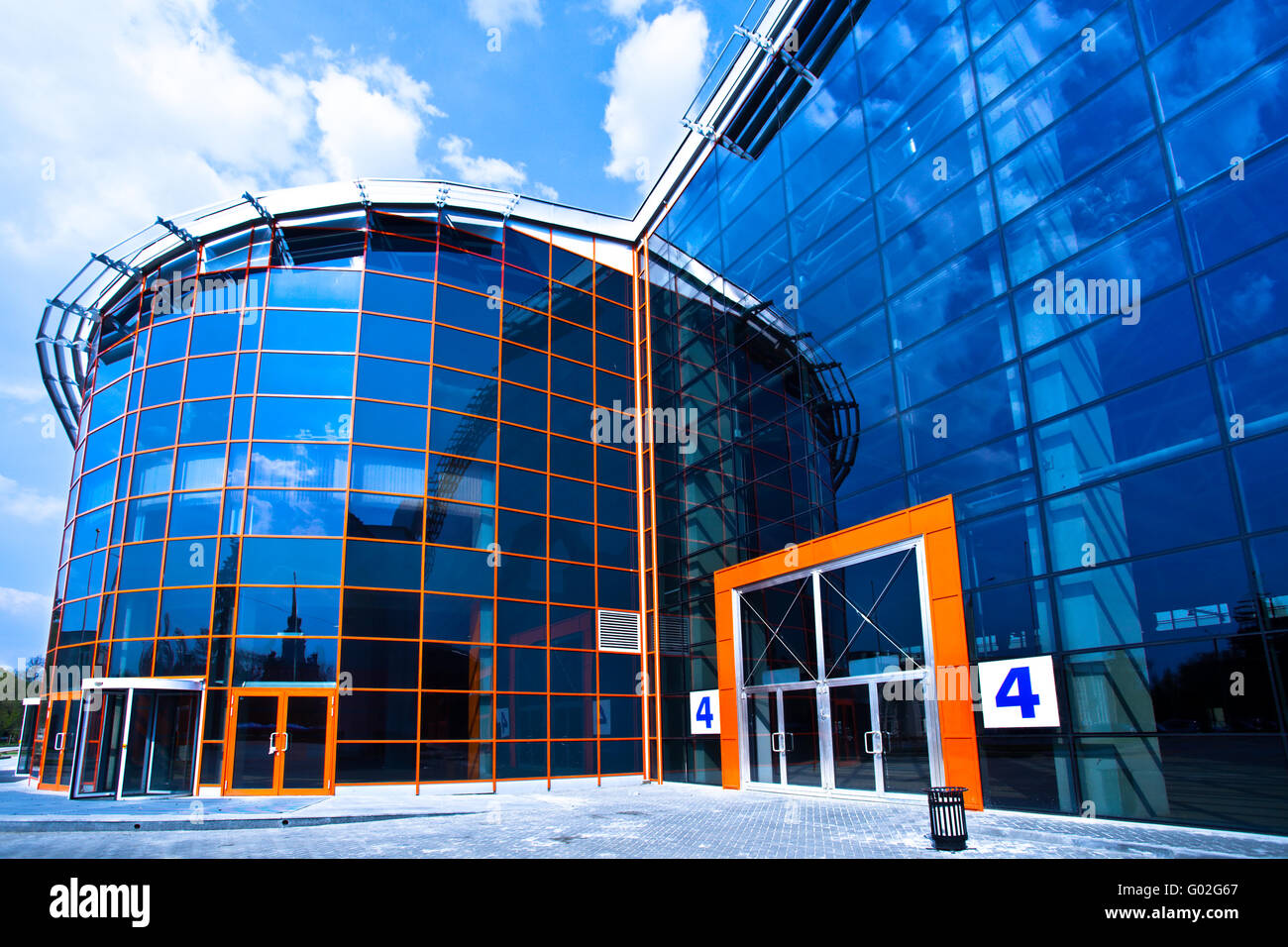 view to enter to modern trade center with orange door Stock Photo Alamy