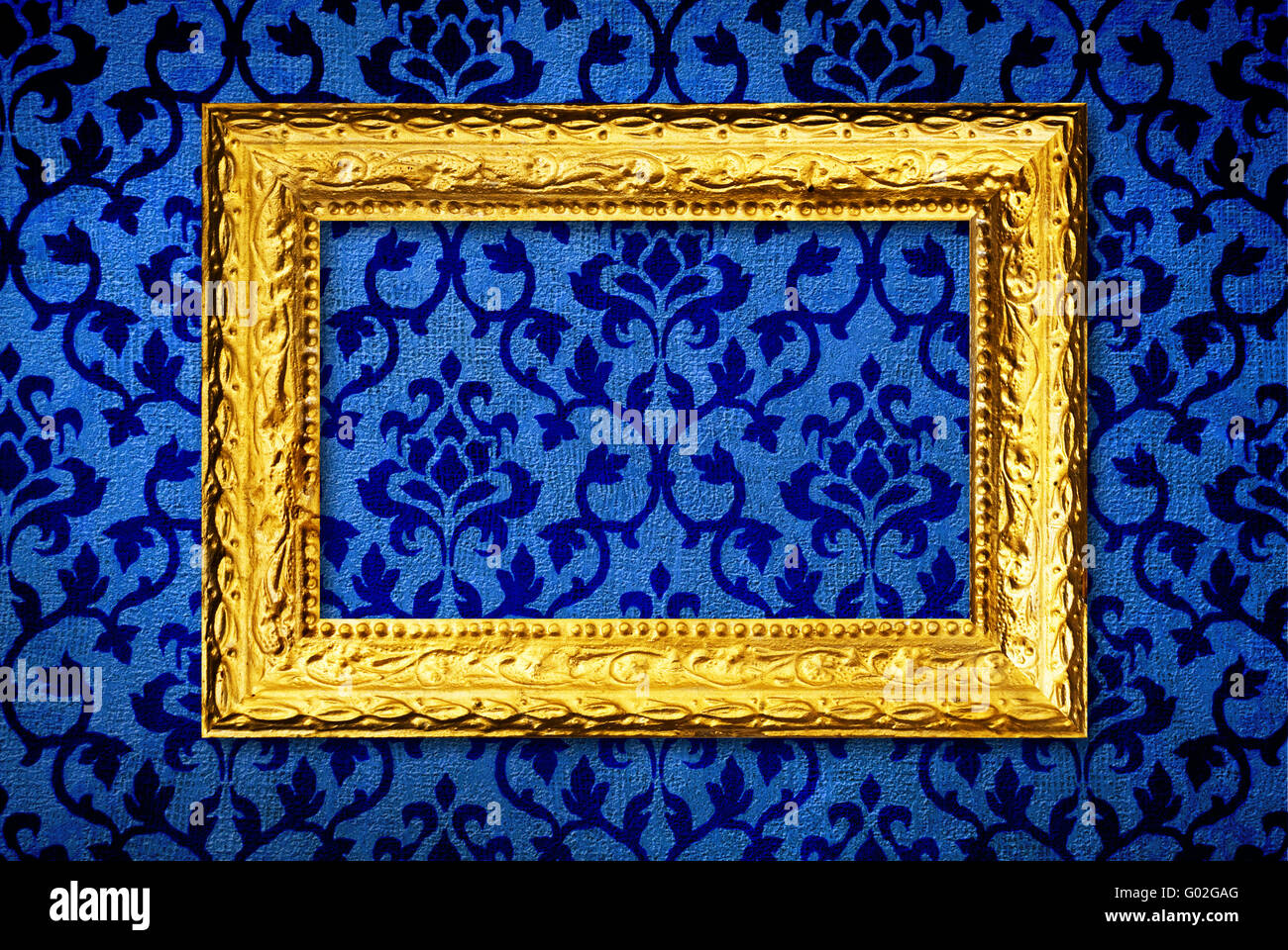 Gold frame on a vintage blue wall background Stock Photo Alamy