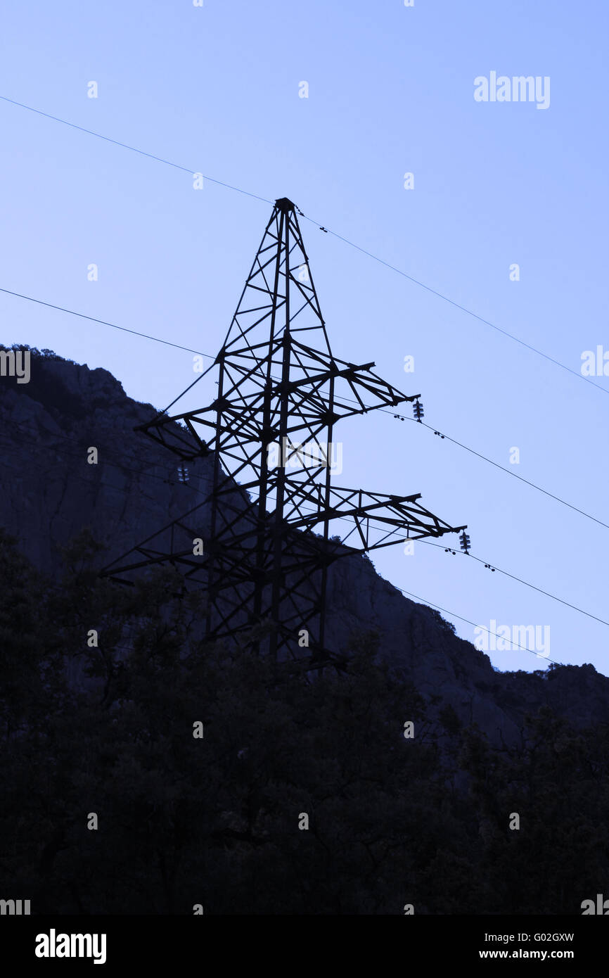Electric power line (high voltage tower) on blue sky Stock Photo - Alamy