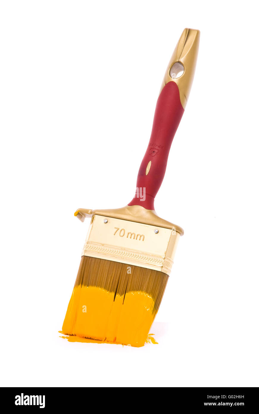 Professional brush with yellow paint on a white background Stock Photo