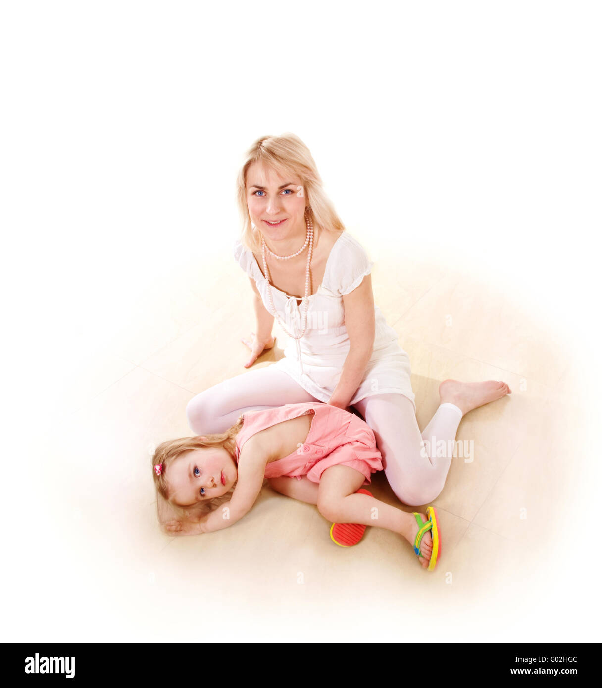 Young blonde woman with little girl Stock Photo