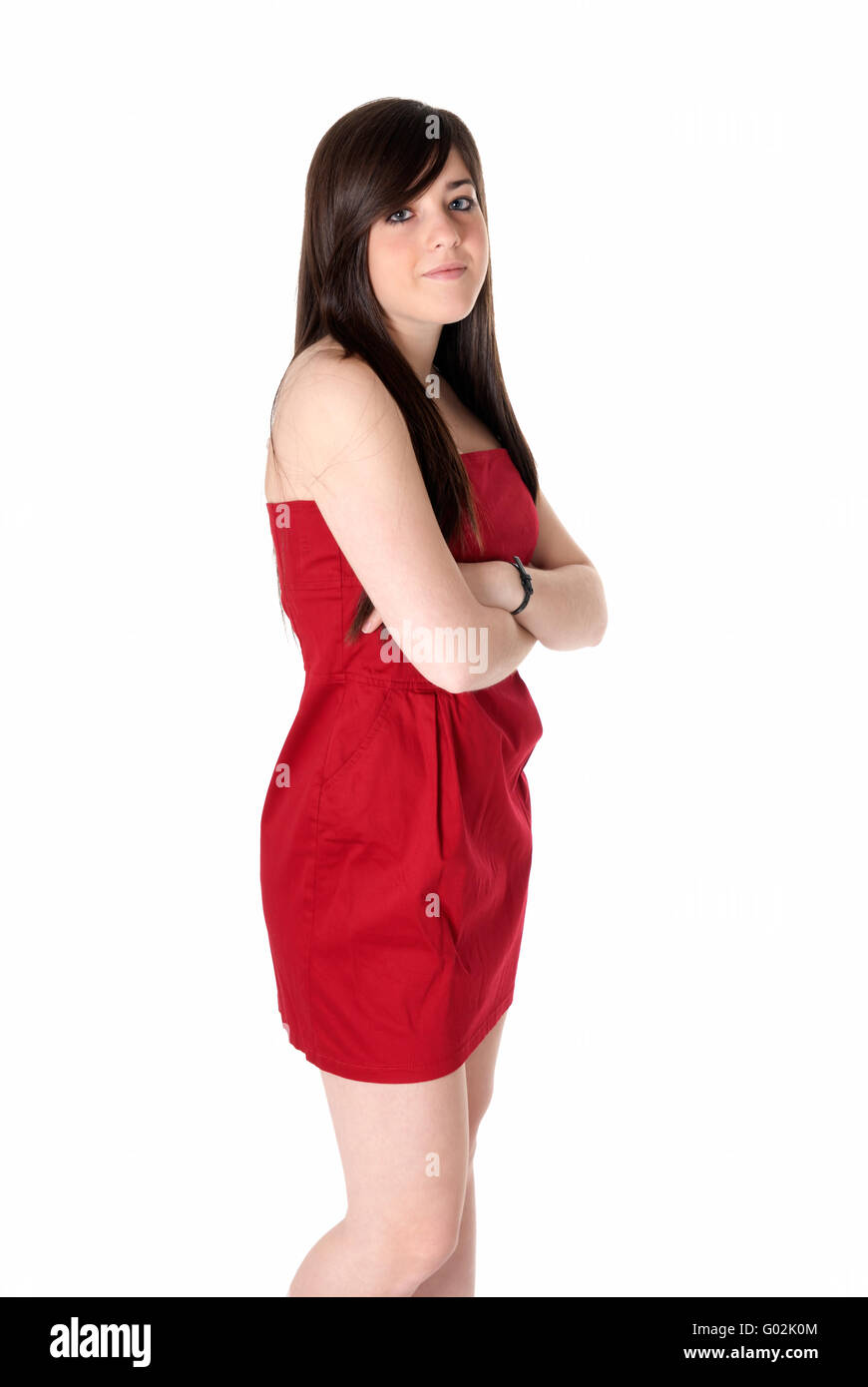 Young beautiful girl with red dress standing isolated on white