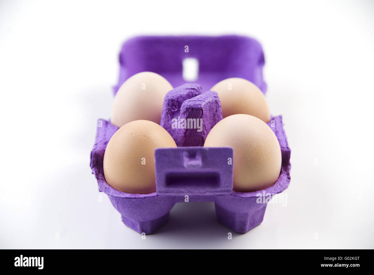 four eggs in a carton Stock Photo Alamy