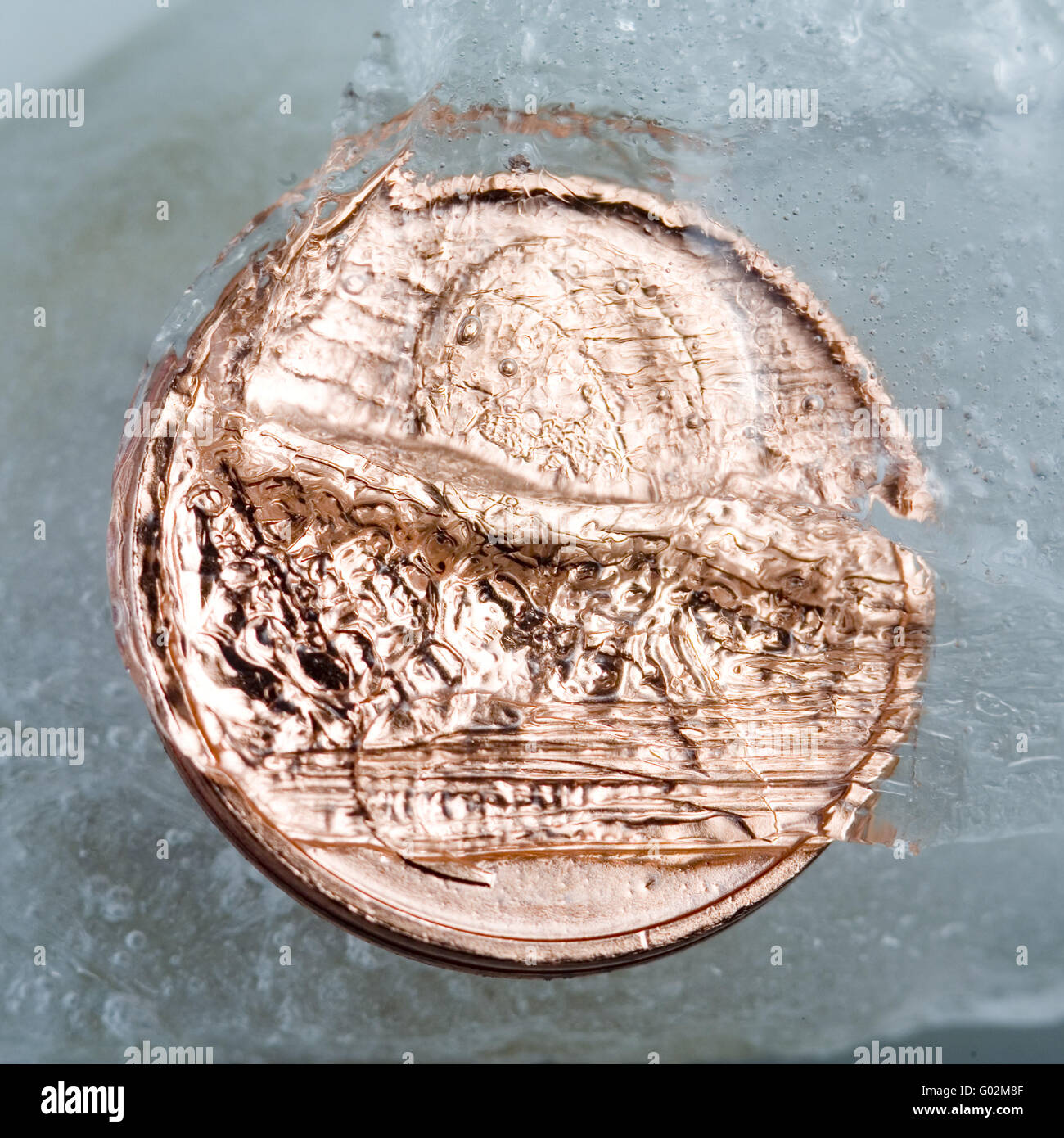 coins in ice Stock Photo