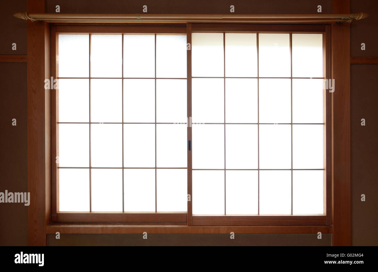 Traditional Japanese rice paper window with sliding wooden frame Stock Photo