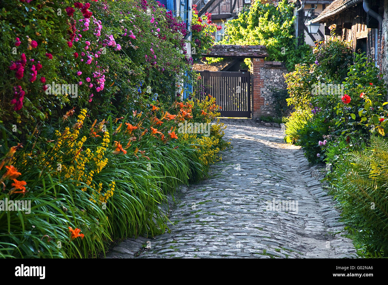 blossoming narrow lane, Gerberoy, Picardy, France Stock Photo