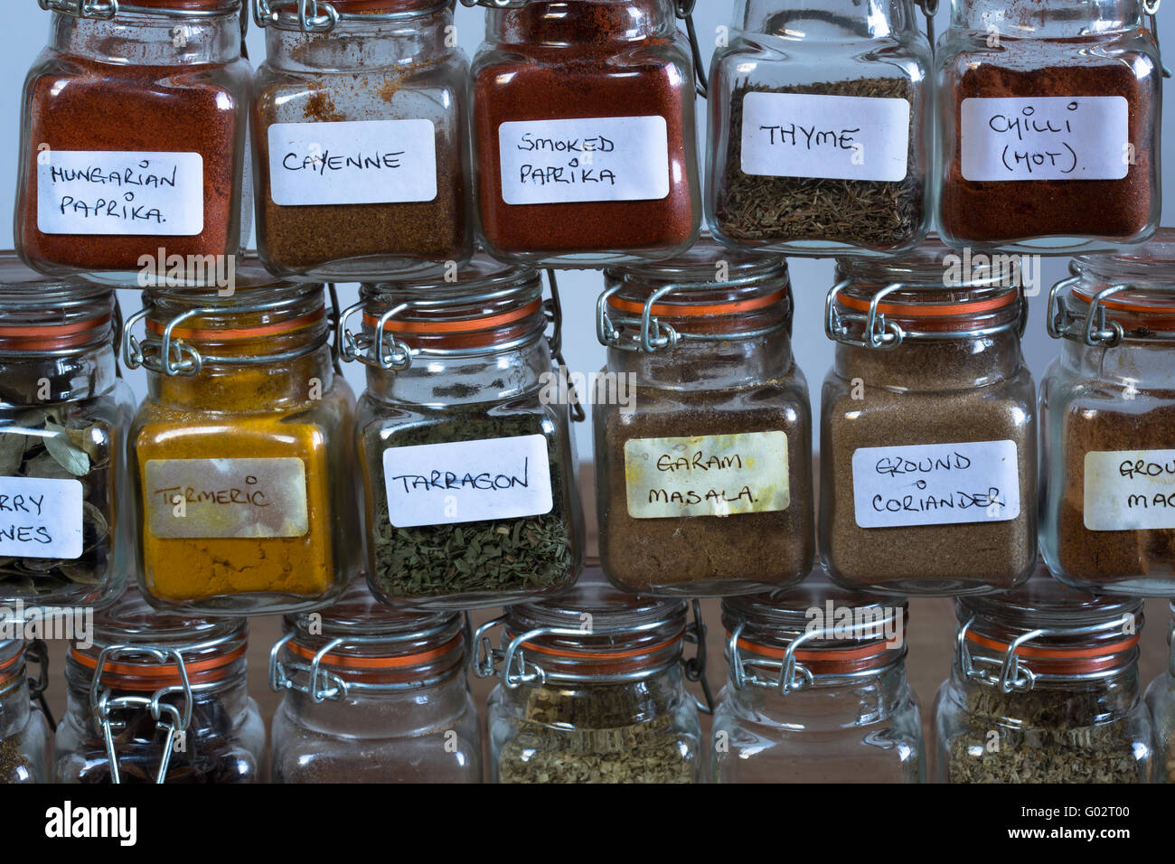 Abstract view of herbs and spices stacked in Kilner jars Stock
