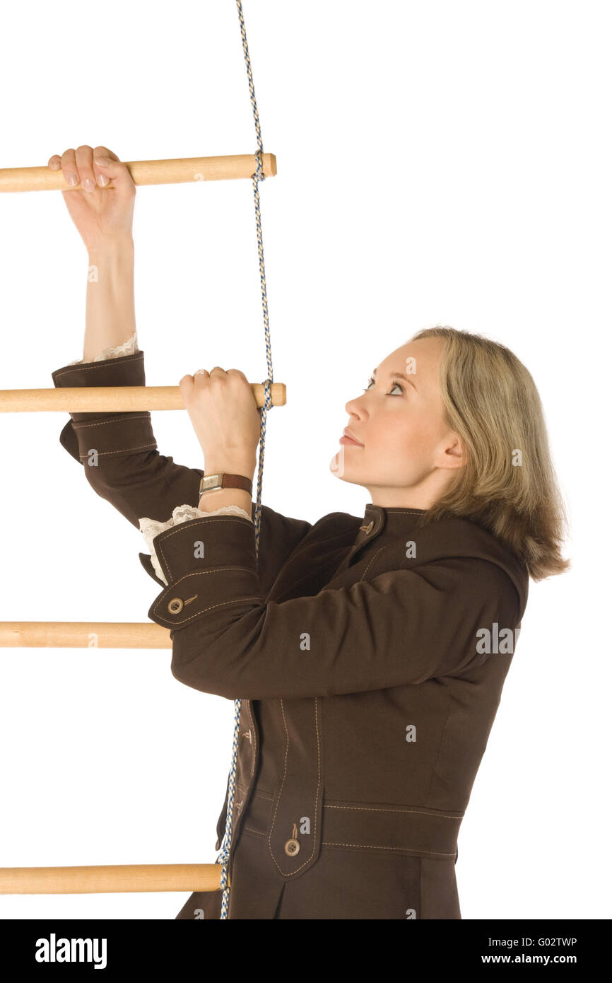 An isolated photo of a businesswoman climbing a ropeladder Stock Photo