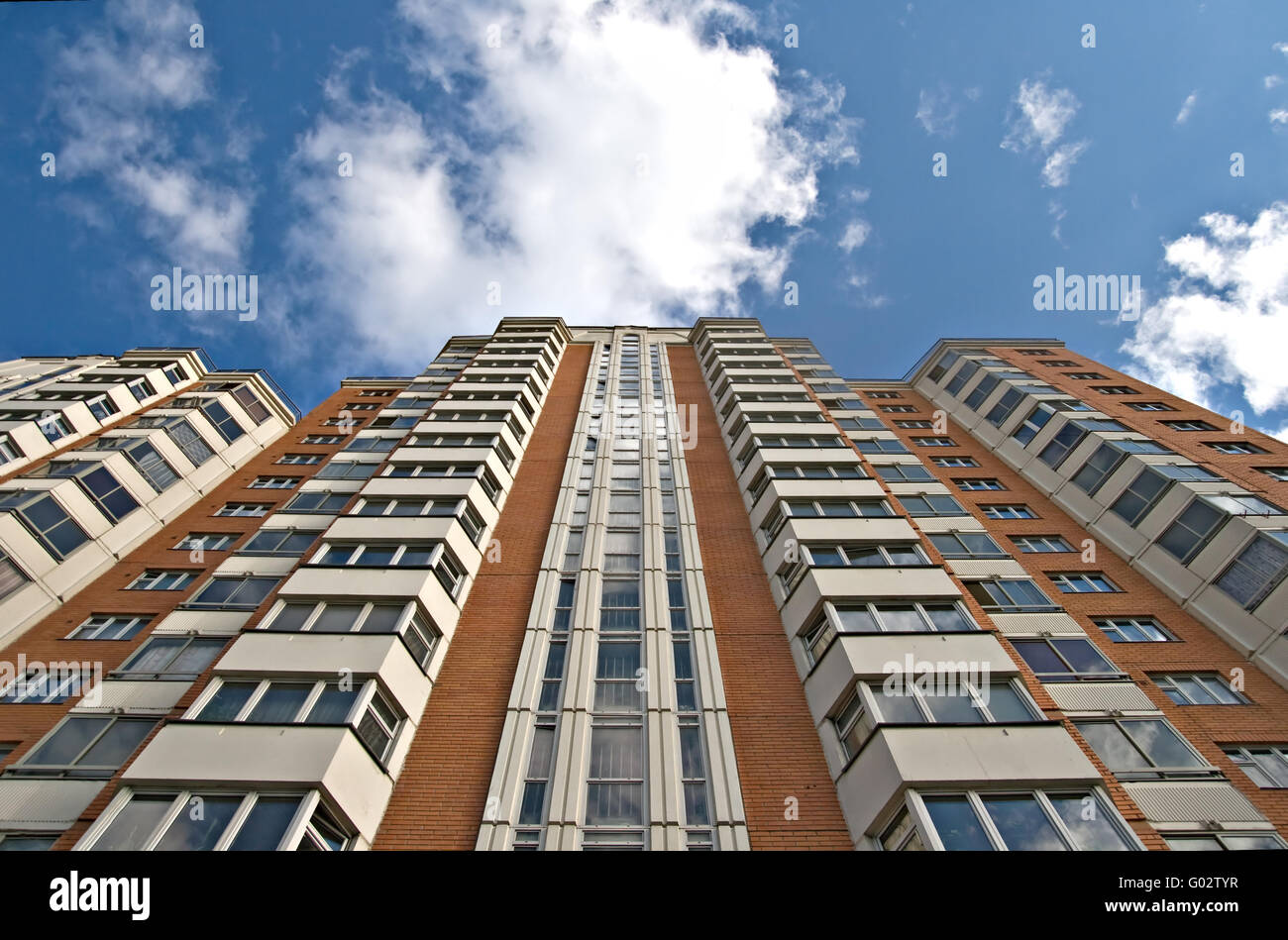A residential multistory house and sky with clouds Stock Photo - Alamy