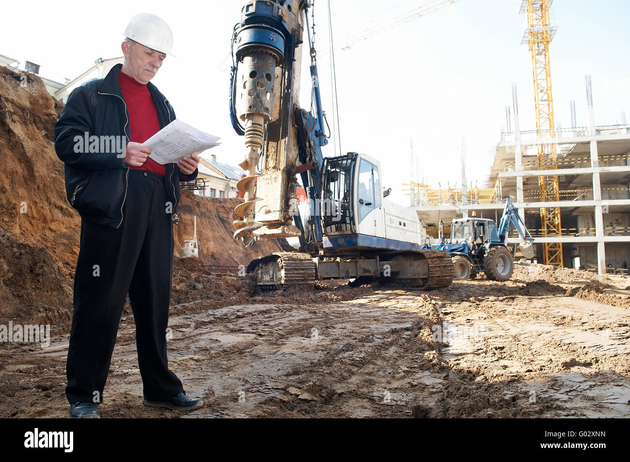 engineer with documentation at construction site Stock Photo