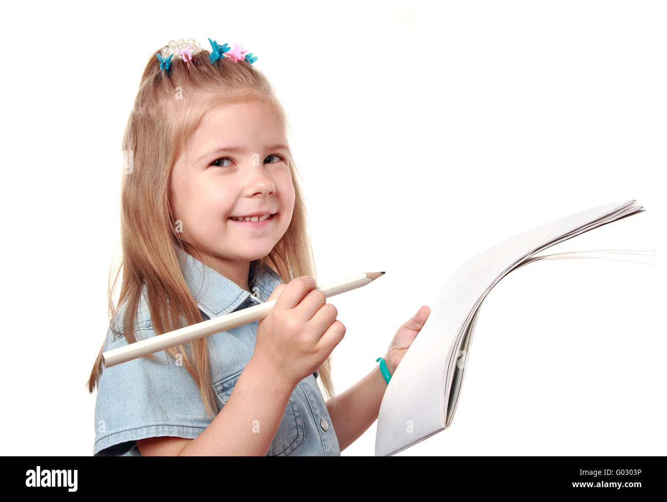 The happy girl with a pencil and an album in hands Stock Photo - Alamy