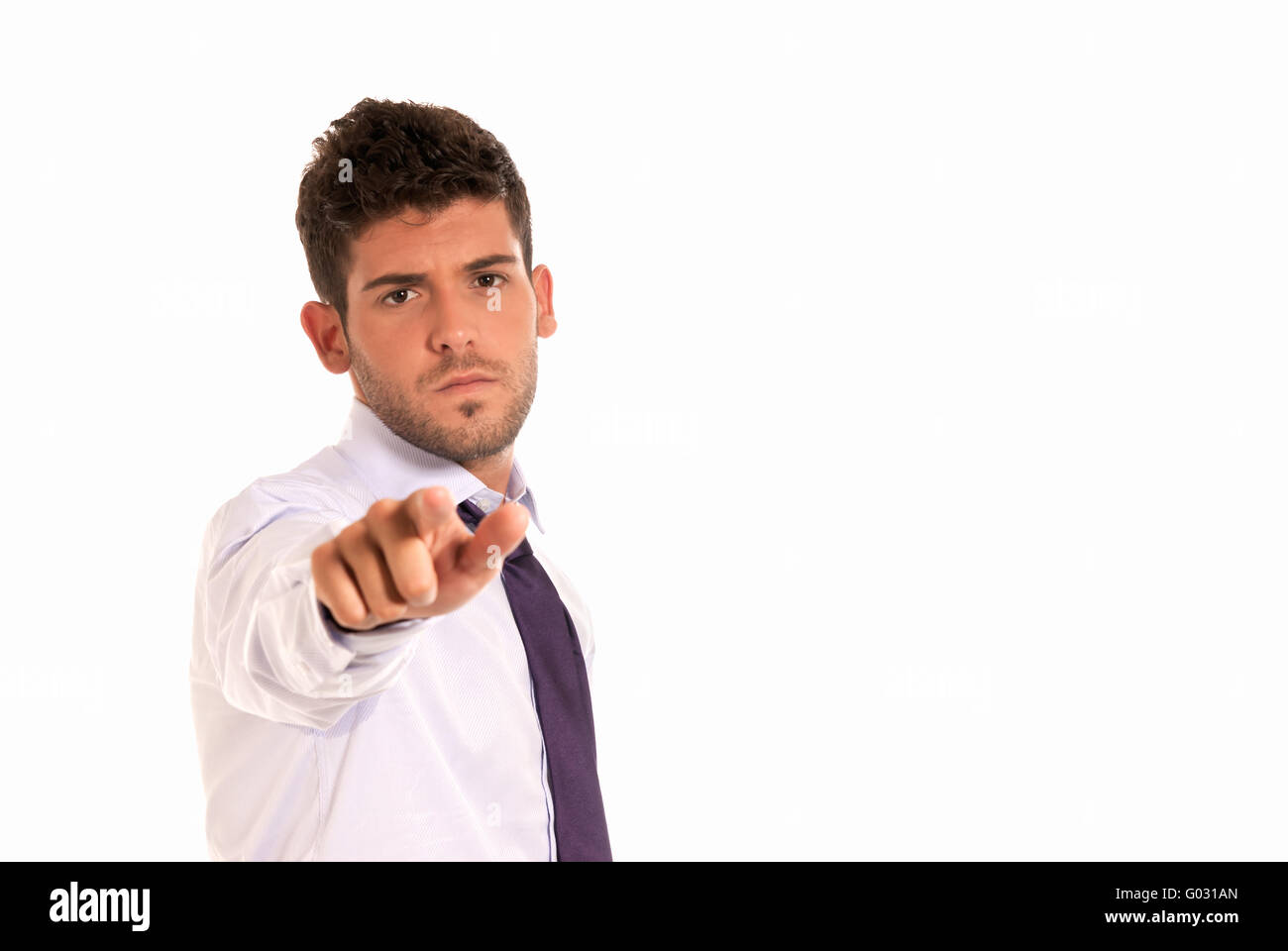 young businessman pointing to camera with copy-space isolated on white background Stock Photo